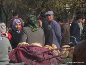 Uyghur Market Uyghur people wander around a Friday market in Xinjiang