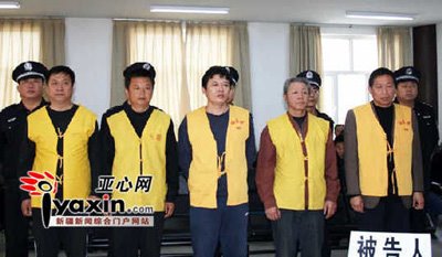 Xinjiang convicts The men convicted in Xinjiang, dressed in yellow
