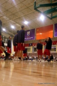 Players warm up to play a game of basketball in Xinjiang