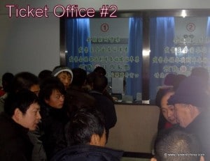 A line of people waiting to buy Chinese train tickets
