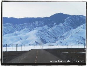 A beautiful Xinjiang highway with a mountain backdrop