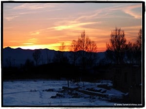A tiny shred of light peeks over the Xinjiang horizon