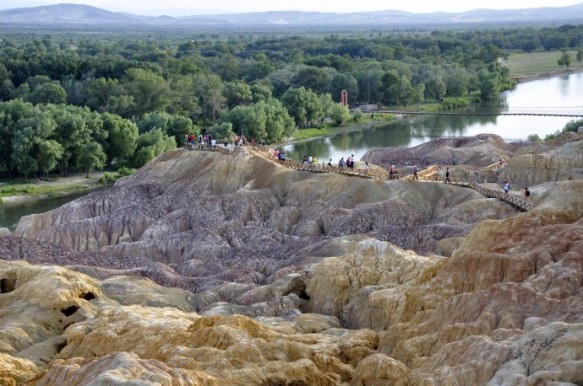 Viewing platforms at the Five Colored Hills Park Tourist fill the viewing platforms at Xinjiang's Rainbow Beach (五彩滩)