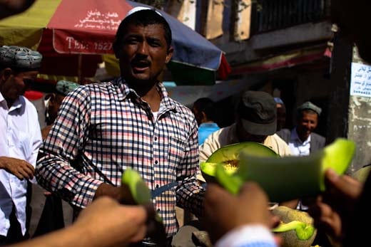 A seller of Hami melons in Xinjiang's Silk Road oasis of Kashgar