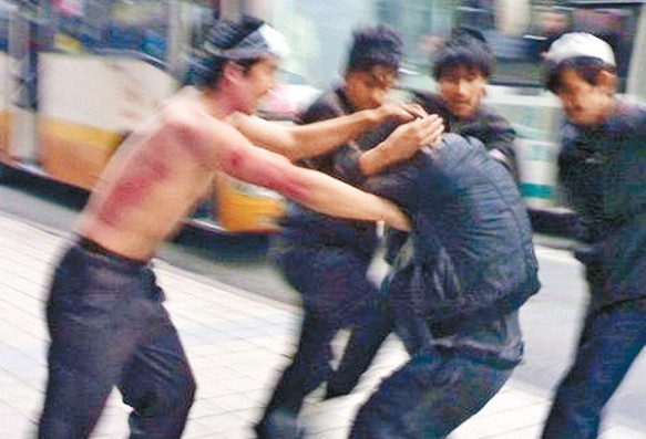 Young men attacking each other in the streets of Korla, Xinjiang