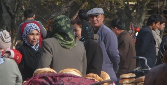 Uyghur people browsing the shops at the Muslim Friday Market