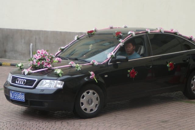 A Chinese wedding car decorated with flowers