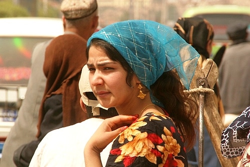 A beautiful Uyghur woman on the streets of Xinjiang