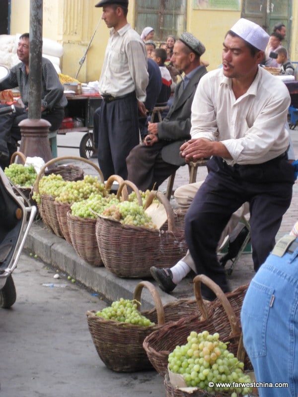 A man sells grapes in Kashgar: Xinjiang, China