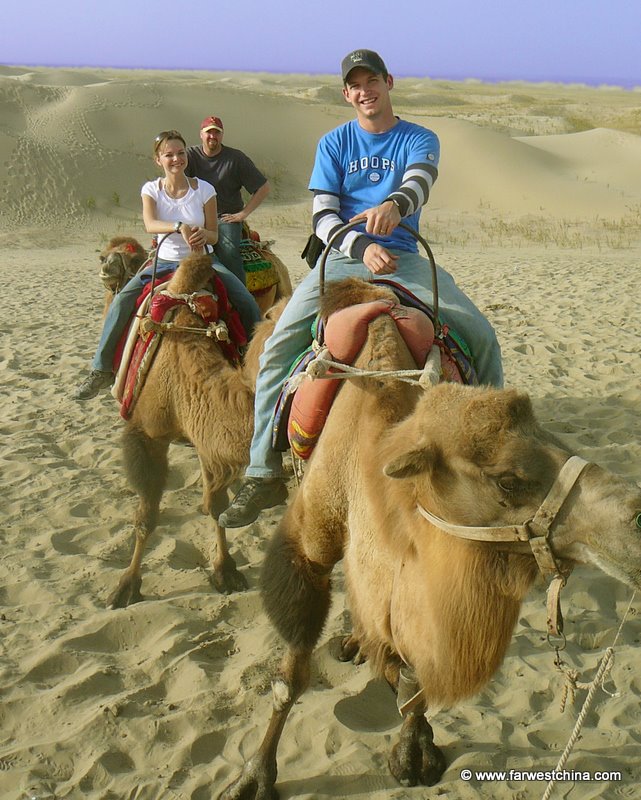 Riding a camel in Xinjiang's Taklamakan Desert