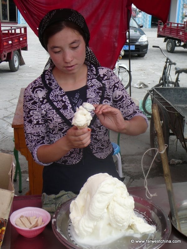 Uyghur woman serves ice cream in Kashgar, Xinjiang