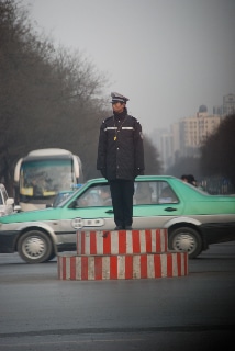 A Chinese policeman directs traffic