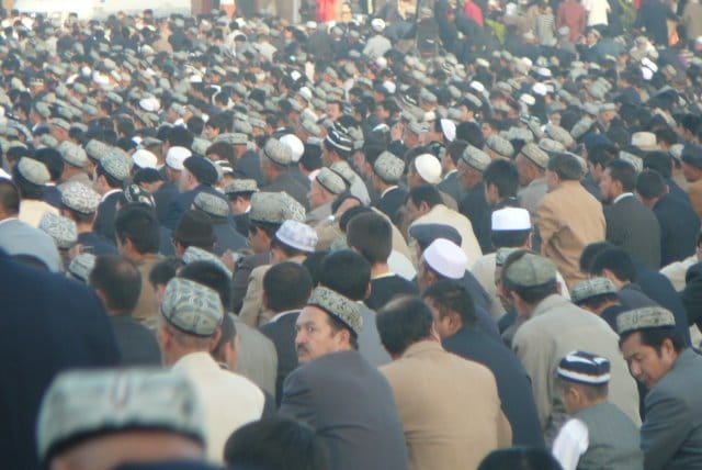 Muslim Uyghur pray on the last day of Ramadan