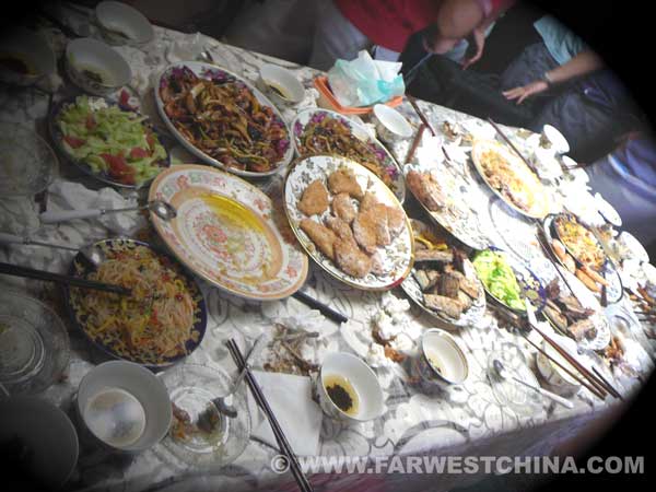 A Uyghur table full of empty plates after a meal