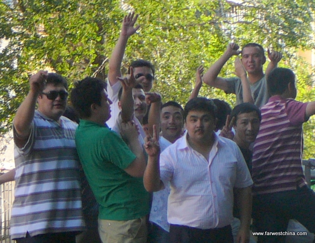 A group of smiling Uyghur men in Xinjiang, China