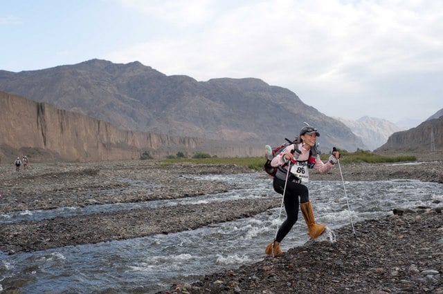 Gobi March women's winner Denvy Lo crosses a stream