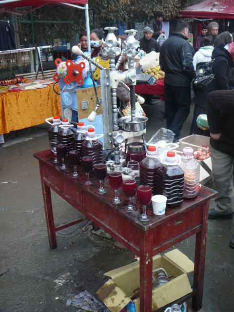 A cart filled with glasses of pomegranate juice in Xinjiang, China