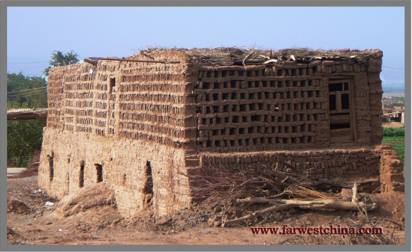 A Uyghur mud-brick building to dry grapes in Tuyoq near Turpan