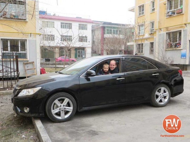 Me and my son in our rented Toyota Camry