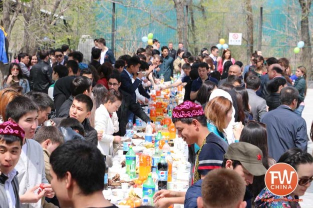 Kazakh men and women of all ages enjoy a modern-day feast