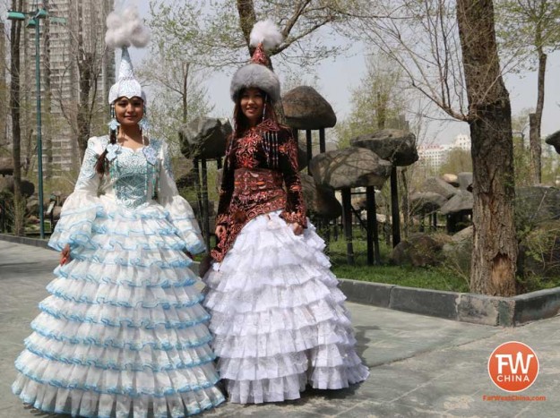 Two Kazakh women dressed in traditional Kazakh dresses