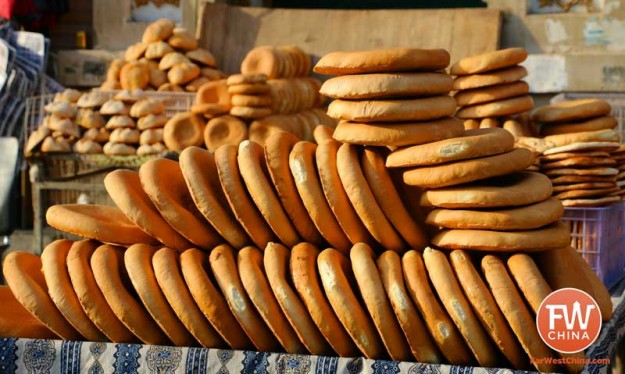 Uyghur bread stacked along a Turpan street in Xinjiang