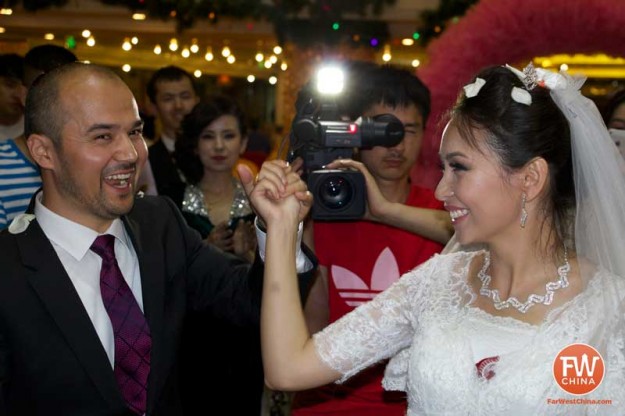 A happy Uyghur bride and groom during their Uyghur wedding in Urumqi, Xinjiang