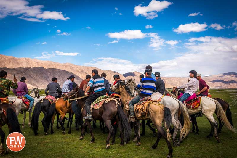 A scrum of Buzkashi Tajik players in Tashkurgan, Xinjiang