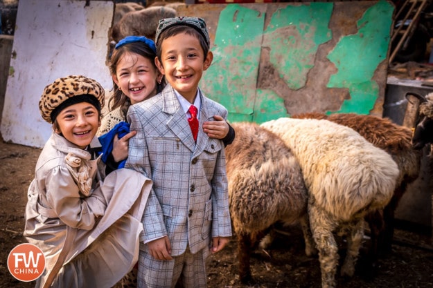 Some cute Uyghur kids dressed up for Corban Festival in Urumqi, Xinjiang