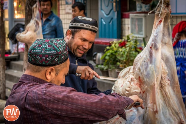 Uyghur men butchering sheep in Urumqi, Xinjiang