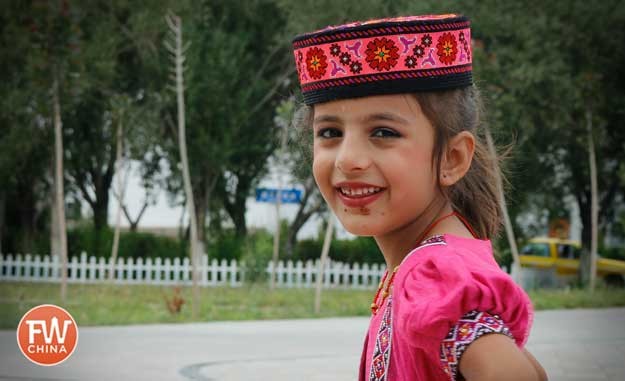 Young Tajik girl dressed up in Tashkorgan, Xinjiang