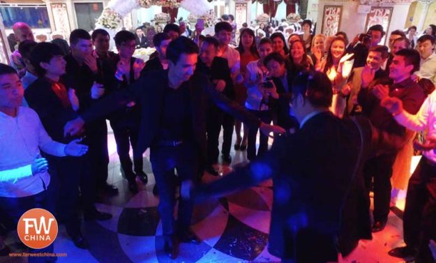 Men dancing with men at a Uyghur wedding in Urumqi, Xinjiang, China