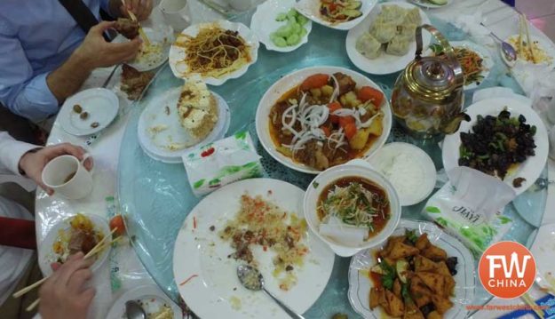 A table full of food at a Uyghur wedding in Urumqi, Xinjiang