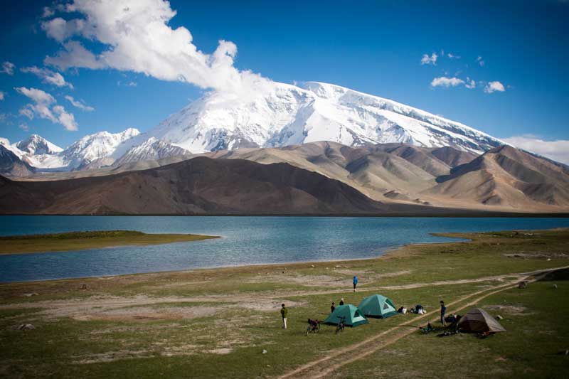 Tent camping in Xinjiang next to Karakul Lake