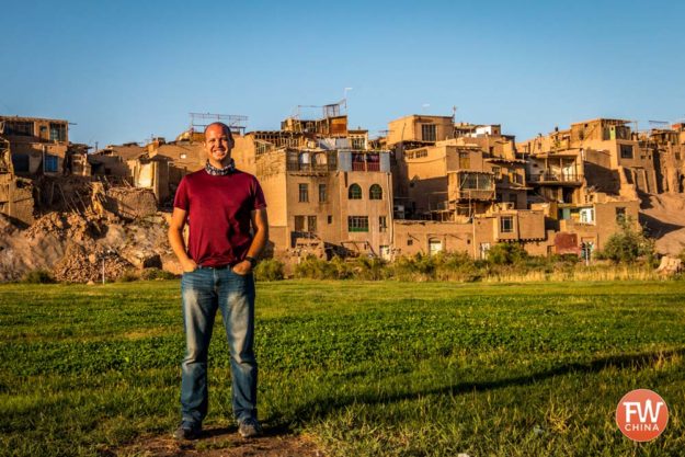 The author in front of Kashgar's Old City