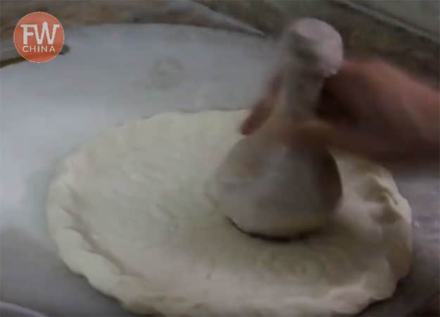 Stamping the Uyghur Bread dough