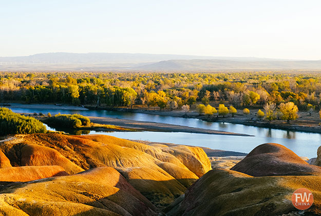 Wucaitan Five colored hills in Xinjiang, China at dusk